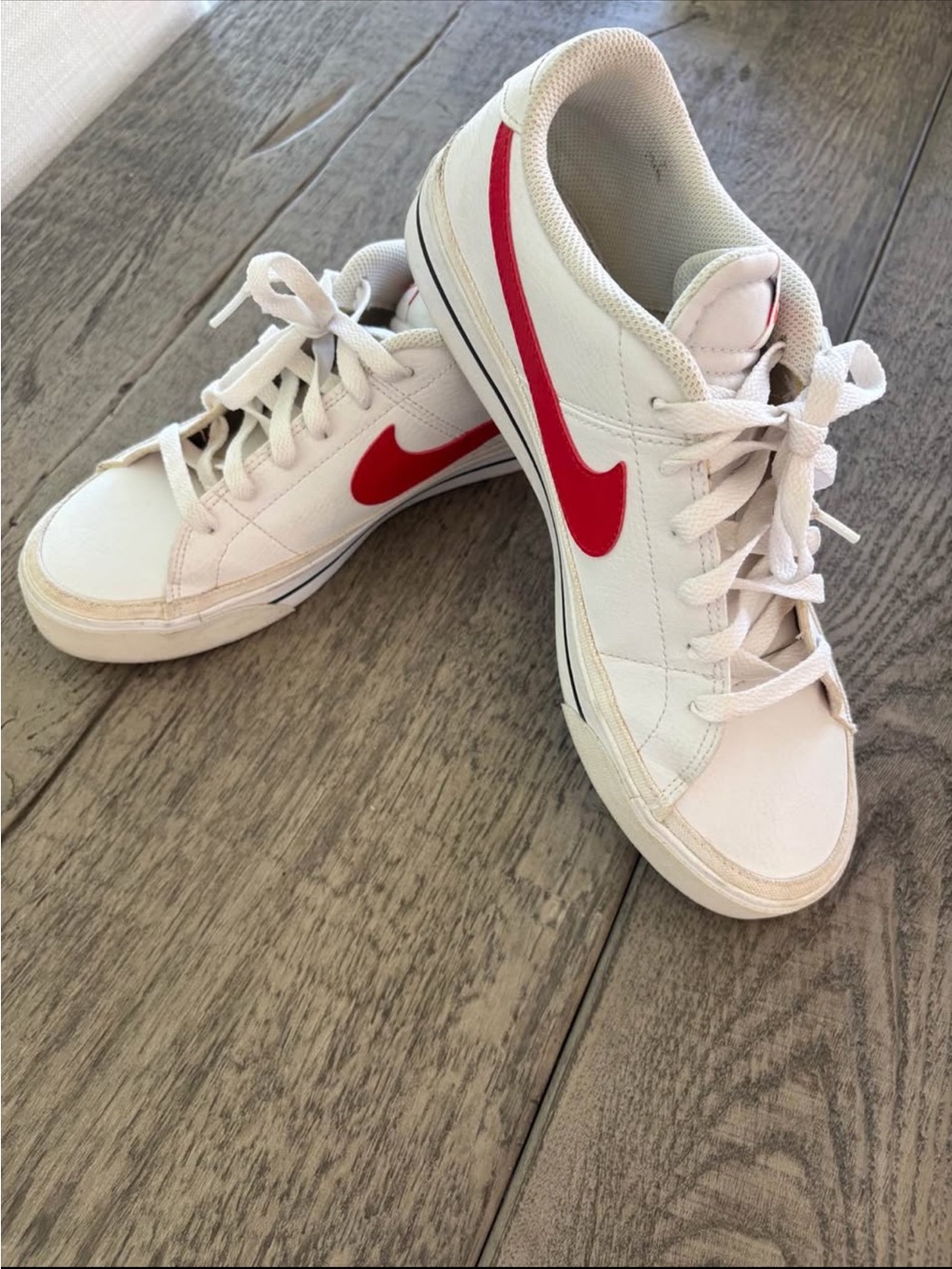 Nike Women’s White Sneakers with Red Swoosh size 9.5
